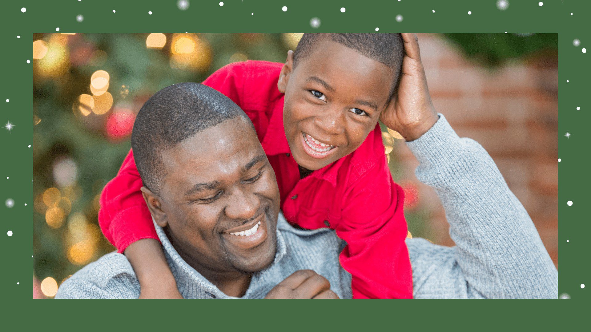 A man and boy smiling for the camera.